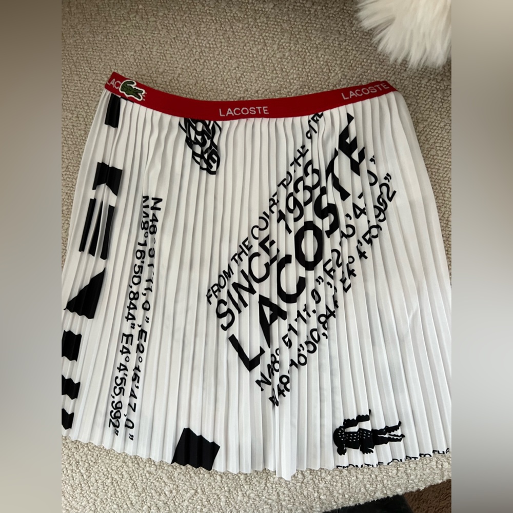 Lacoste pleated skirt kids size 2 (runs long)